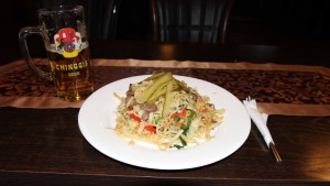 Traditional Mongolian pasta with mutton and a Chinggis Khan beer.