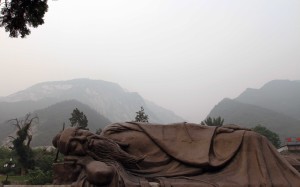 Sleeping Buddha in front of the temple on the way to Mount Hua.