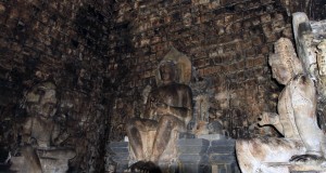 The three Buddha statues inside Candi Mendut.