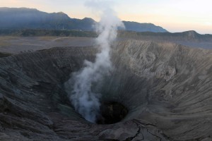 The opening shaft of Mount Bromo seen past sunset.