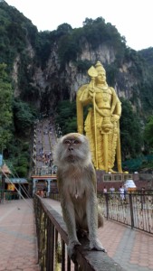 Monkey on the railing at the entrance to Batu caves.