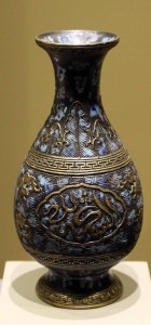 A vase with Arabic calligraphy and Islamic motif.
