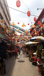 Petaling Street Market in Chinatown during the hot light of the day.