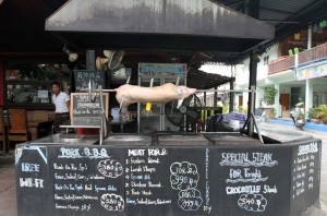 Pig roasting on a spit at a restaurant in Chaweng.