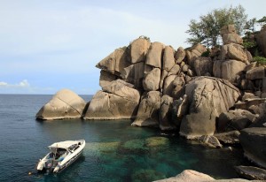 Small bay surrounded by boulders.