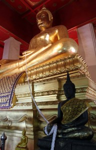 The giant bronze Buddha statue seated inside Wat Phra Mongkhon Bophit.