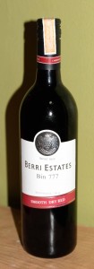 Bottle of dry red wine made from grapes grown in Australia and fermented in Thailand.