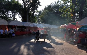Smoky street inside a market in Vientiane.
