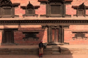 Woman taking a break in front of the "Palace of Fifty-five Windows".