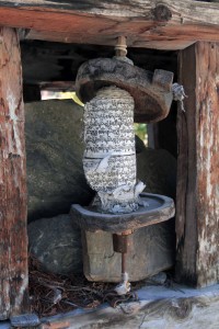 A prayer wheel missing its cover.