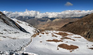 The trail leading down to Muktinath and the arid valley below.
