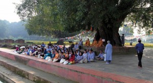 Gatherers outside, near the giant pond where Siddhārtha's mother bathed before giving birth.