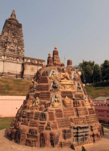 Small stupa with many small Buddha reliefs.