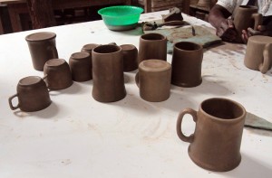 Clay cups being molded at the Kazuri bead and pottery factory.