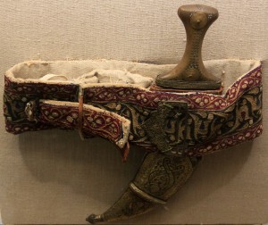 Curved dagger with sheath and fabric belt from the Ottoman era.