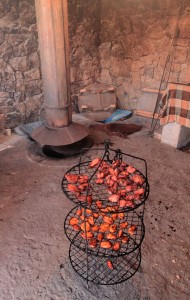 Barbeque port and slices of potatoes on a rack, taken out of the Armenian tonir.