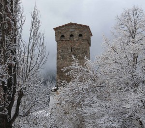 A medieval tower standing amongst the recent snowfall.