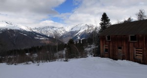 The Caucasus Mountains and an abandoned cabin, seen by looking north from the ski resort.
