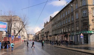 Pedestrians crossing a street in Lviv.