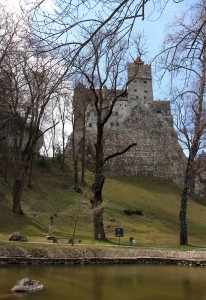 Bran Castle seen from the pond in the gardens.
