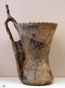 Cup with modeled snakes and mourners on the handle (675-650 BC).