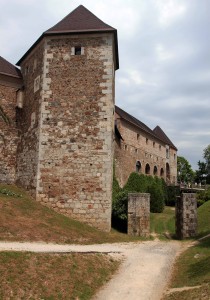 Corner view of the castle with the entrance in the distance.