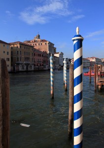 Candy-colored docking poles along the Grand Canal.