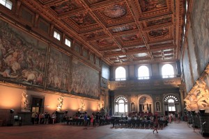 Standing in the Great Hall inside the Palazzo Vecchio.