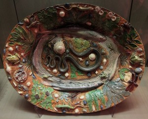 A glazed earthenware dish with "rustic figulines" (16th-century AD).
