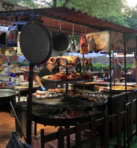 Various meats being grilled at a food stall in Pamplona.