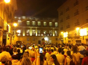 A crowd of people in a square celebrating the end of the festival.