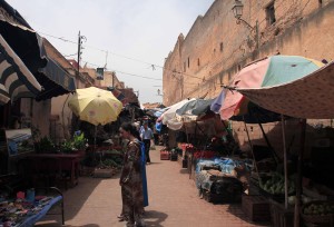 Vendors selling their goods along a street in the medina.