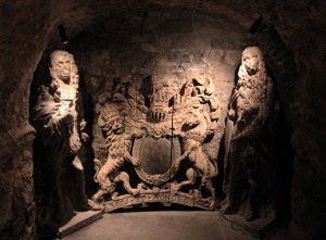Statues of Charles I and Charles II with the Royal Arms, located inside the crypt under the Cathedral.