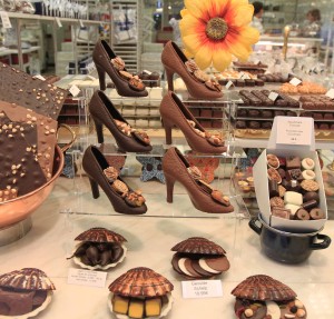 Chocolate high-heeled shoes and clam shells in a Belgian Chocolate Shop.