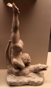 A Roman marble sculpture depicting an African acrobat on a crocodile; it may depict a member of the Tentrytae tribe of Egypt, who were famous for diving on the backs of crocodiles in the Nile River (ca. 1st-century BC or 1st-century AD).