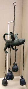 A Roman Bronze tintinabulum; objects like this were suspended in gardens and a winged-lion phallus was believed to provide protection against evil and to bring good luck to the household (1st-century AD).