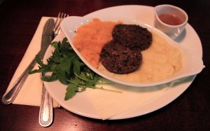 Haggis served with mashed neeps ("swede turnips") and tatties ("potatoes") and a whiskey cream sauce.