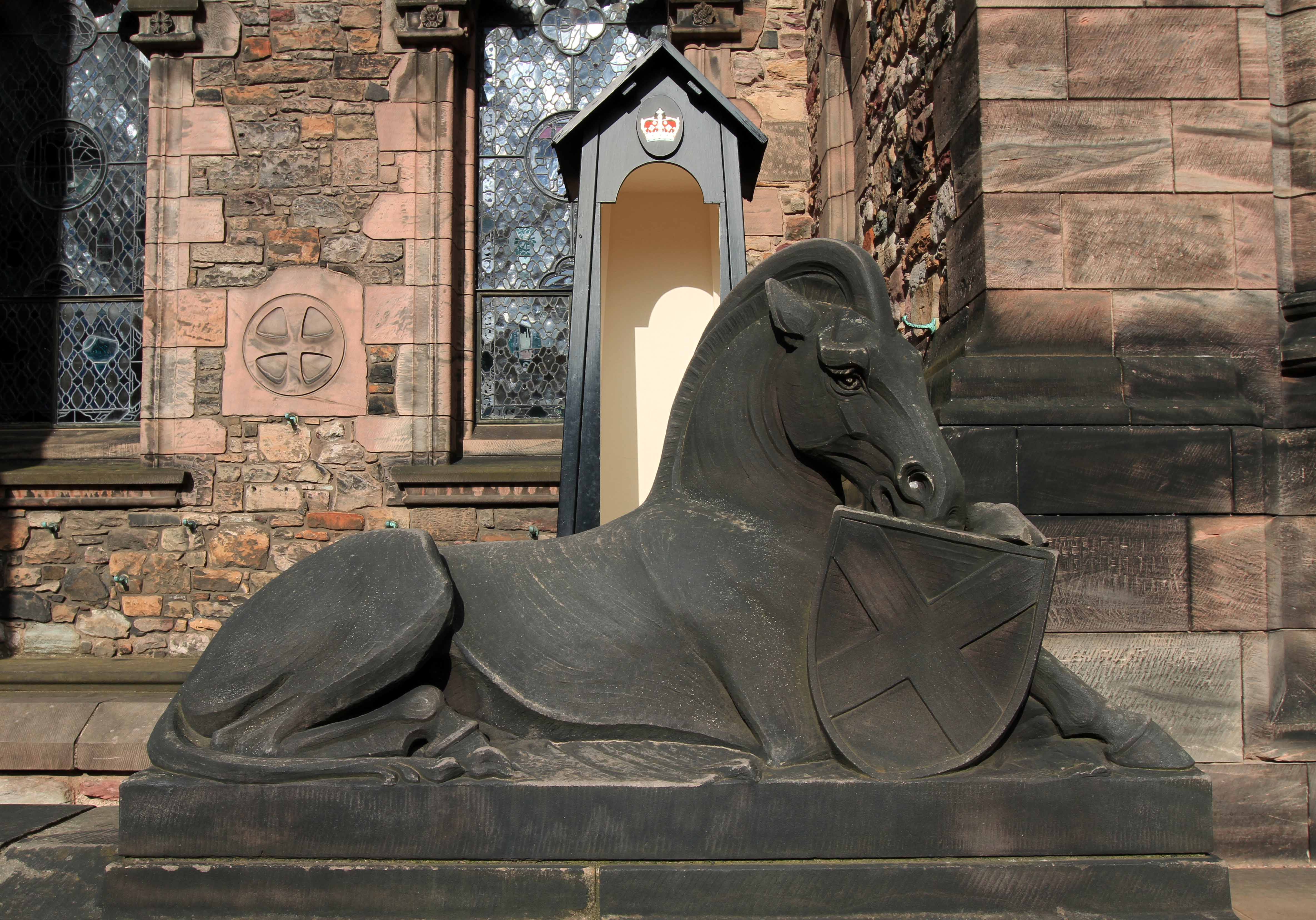 Statue of a horse and shield outside the entrance to the Scottish National War Memorial.