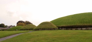 The large mound (or passage tomb) and three smaller, satellite mounds (or tombs) at the Knowth site.