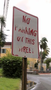 A peeling parking sign.